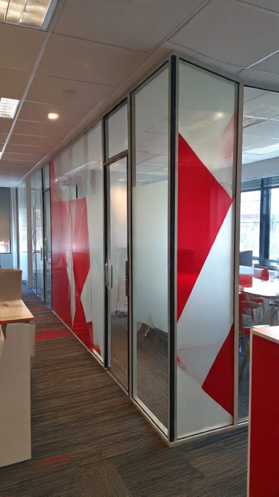 custom office partitions Rosebank, branded office partitions, aluminium glass partitions, corporate branding office design, office partition customization, office design solutions Rosebank, Accend Aluminium and Glass, glass office partitions, modern office partitions, office interiors South Africa, office branding ideas, corporate office renovations, workspace design Rosebank, frosted glass partitions, vinyl graphics office, printed glass panels, movable office partitions, soundproof office partitions, aluminium frame partitions, office privacy solutions, collaborative office spaces, office layout optimization, branded office environment, office productivity solutions, office partition maintenance, office partition installation, office design consultancy, branded meeting rooms, corporate office aesthetics, professional office interiors, office branding and functionality
