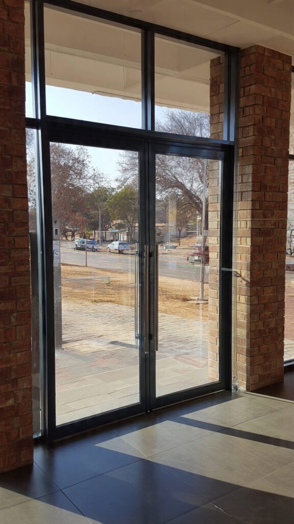 commercial aluminium doors Bulawayo, aluminium door security features, secure aluminium doors Zimbabwe, commercial door security Bulawayo, aluminium shopfront security, reinforced aluminium doors, burglar-resistant aluminium doors, access control aluminium doors, toughened glass doors Bulawayo, security glazing aluminium doors, commercial property security Bulawayo, anti-tamper door hardware, aluminium door locking systems, multi-point locking aluminium doors, security doors for businesses Bulawayo, aluminium frame strength, intrusion-resistant doors Zimbabwe, commercial door safety features, aluminium door installation Bulawayo, durable aluminium doors for businesses, business security solutions Bulawayo, aluminium entrance doors security, high-security aluminium doors, aluminium door hinges security, aluminium door protection features.